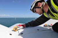 A 3sun technician working at height on a wind turbine